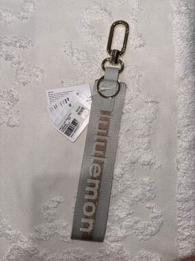 Lululemon grays/mint Never Lost Keychain with Gold Logo Accent